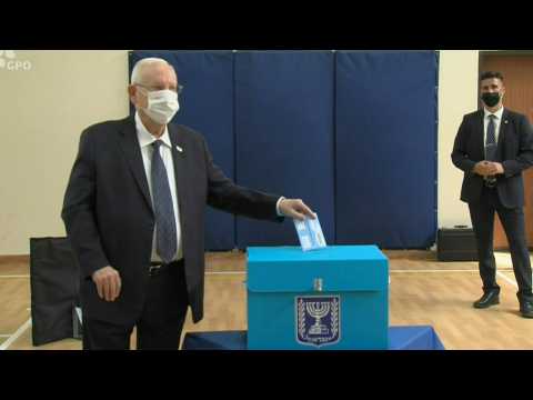 Israeli President Reuven Rivlin casts his vote in the Israeli elections