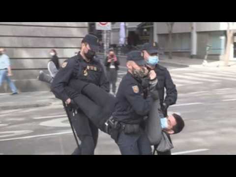 Police disperse activists during climate protest in Madrid
