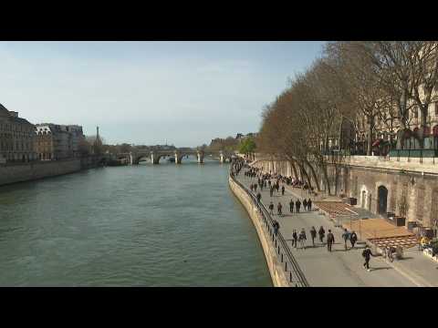 Parisians enjoy spring weather on the banks of the Seine river