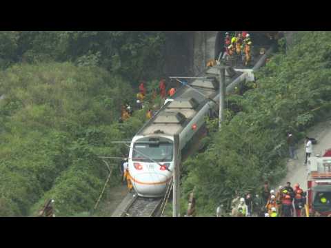 Images of Taiwan train crash site and rescue workers