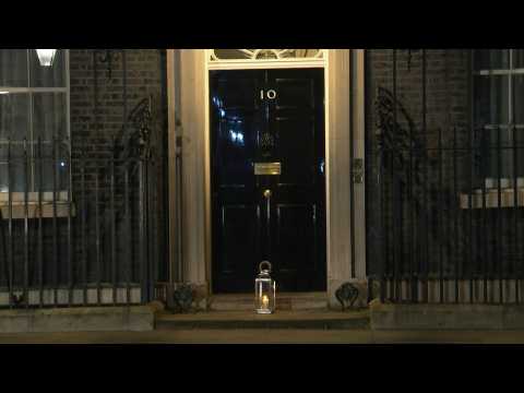 A candle lit outside Downing Street to commemorate Covid-19 victims