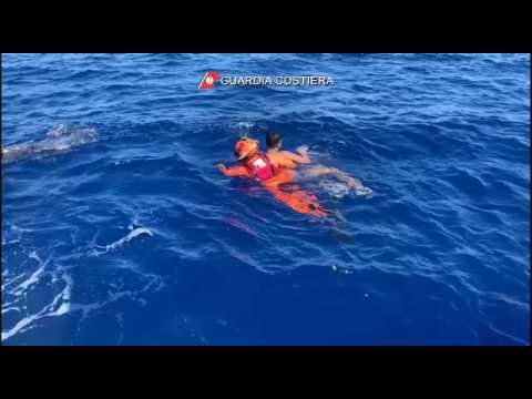 Italian coastguard rescues migrants from waves near Lampedusa