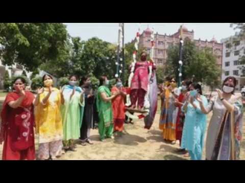 Women in India sing and dance to celebrate the Teej festival