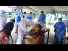 Health workers carry out coronavirus tests in Kathmandu