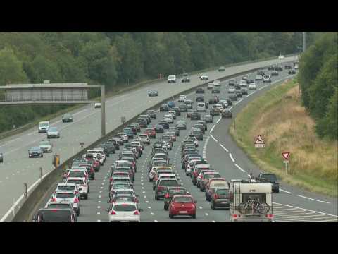 Dense traffic outside Paris as holidaymakers travel south