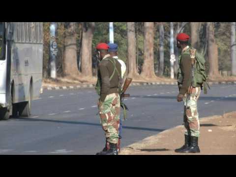 Zimbabwe soldiers enforce protest ban on empty streets of Harare