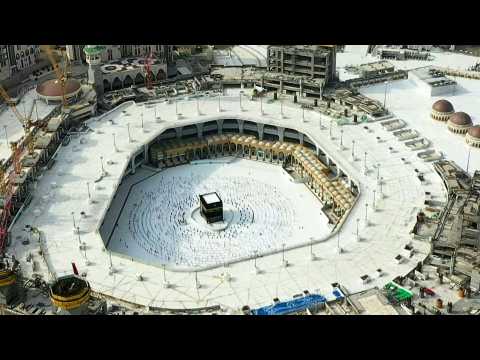 Muslim pilgrims circle Mecca's Kaaba