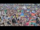 Crowds gather at UK beaches despite warnings