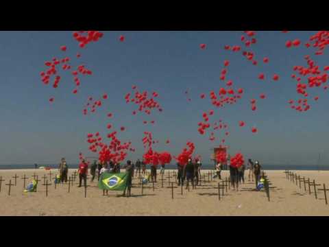 A thousand red balloons are released as a tribute to the 100,000 Brazilians killed during the pandemic