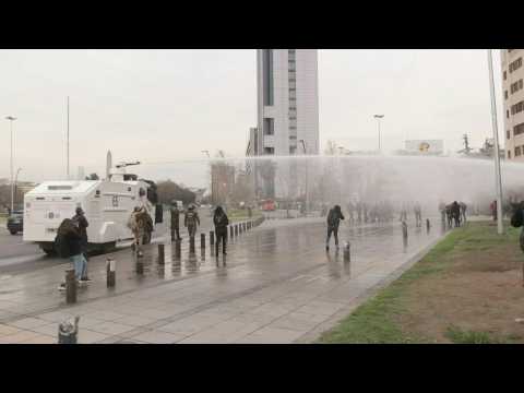 Demonstrators dispersed with water cannon at Chile's emblematic Plaza Italia