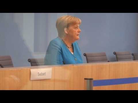 Angela Merkel arrives at press conference in Berlin