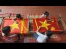 Vietnamese village famous for embroidery makes national flags ahead of Independence day