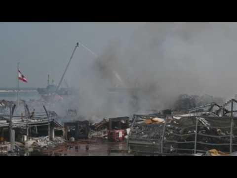 Firefighters continue to extinguish small fires at the Beirut port