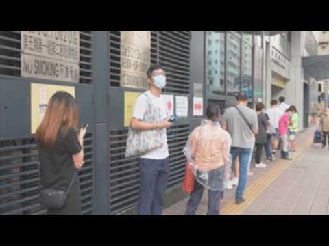 People in Hong Kong queue up to get tested for coronavirus
