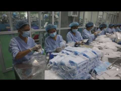 Face mask makers in Vietnam ramp up production to meet global demand