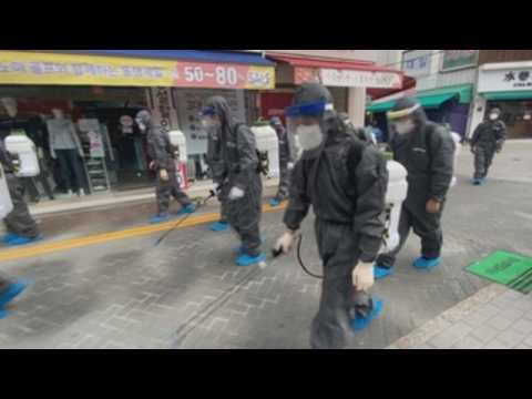 South Korean authorities disinfect streets in Seoul to prevent spread of COVID-19
