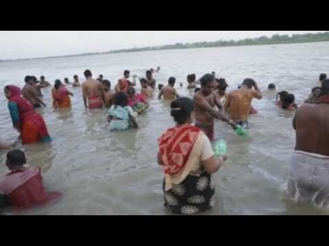 Hindu devotees bathe in river Ganges during Pitru Paksha festival in India