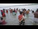 Hindu devotees bathe in river Ganges during Pitru Paksha festival in India