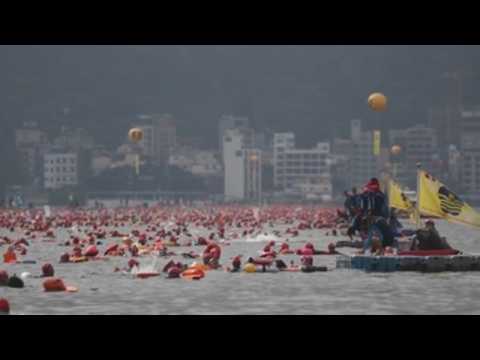 Thousands swim across lake during annual swimming event in Taiwan