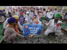 Farmers burn JIO SIM packs during anti-corporations protest in India
