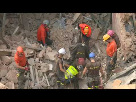 Rescue workers search for survivors one month after Beirut blast