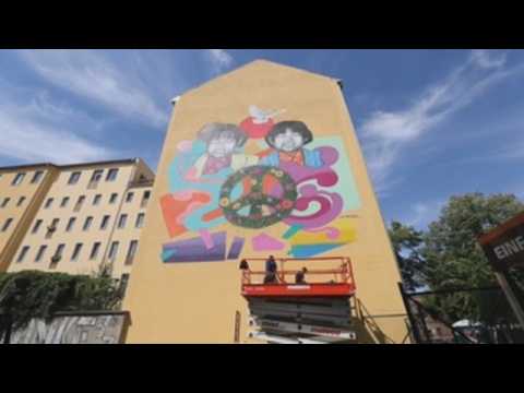 Visual artist Eme Freethinker paints mural in Berlin to mark 75th anniversary of Hiroshima and Nagasaki