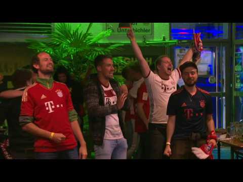 Football/Champions League: Bayern fans celebrate after Kingsley Coman scores
