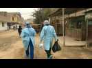 Medical workers test Lima suburb residents for Covid-19