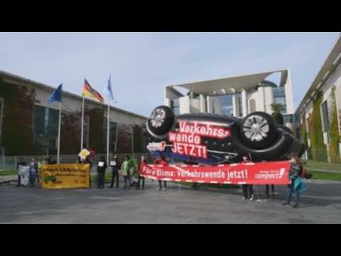 Activists protest against the motor industry in front of Chancellery in Berlin