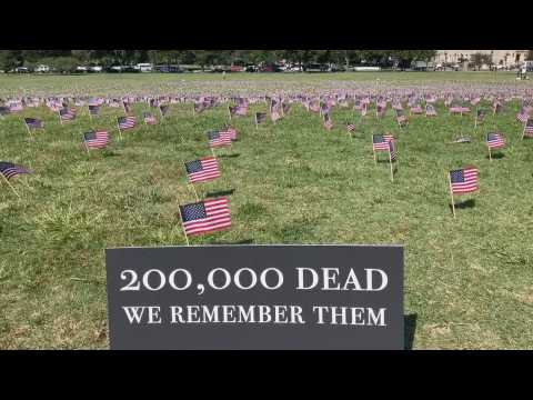 Thousands of American flags commemorate the 200,000 deaths of COVID-19