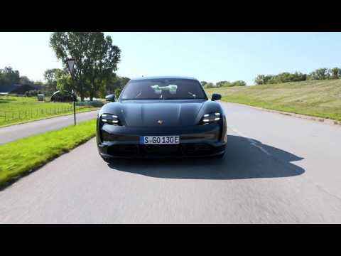The new Porsche Taycan Turbo in Volcano Grey Metallic Driving Video