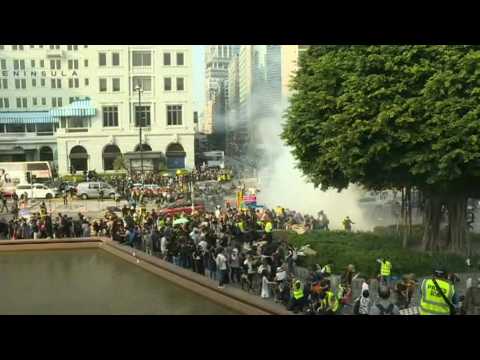 Hong Kong police fire tear gas at protesters on harbourfront