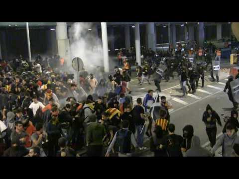 Police and protesters clash at Barcelona airport