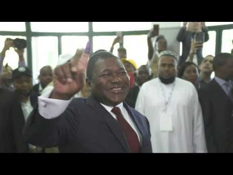 Mozambique's Filipe Nyusi votes as polls open in tense election