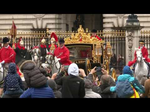 Queen Elizabeth II leaves Buckingham Palace by horse-drawn carriage