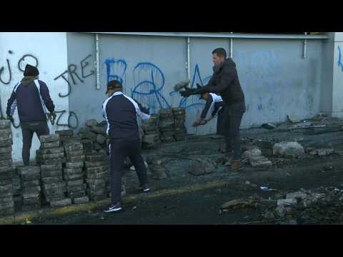 Workers clean Quito's streets after govt and protesters reach deal