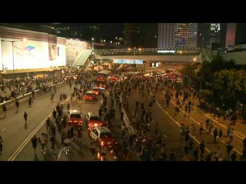 Hong Kong: activists swarm to block major road