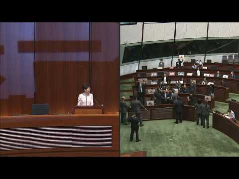 Hong Kong leader abandons policy speech after heckling from lawmakers