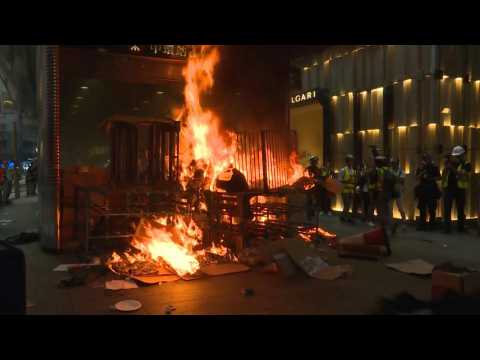 Fire roars outside Hong Kong's Central metro station after protest