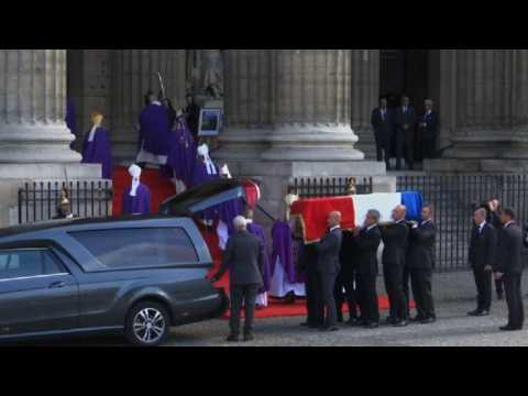 French ex-president Chirac's coffin arrives for church service