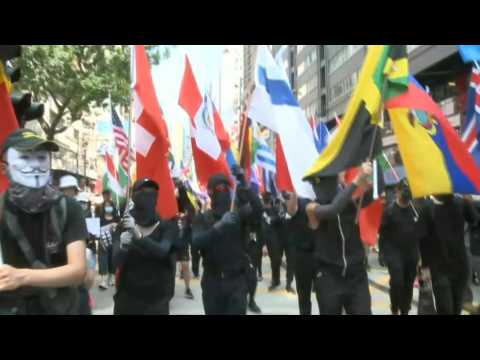 HK pro-democracy protesters march at popular shopping district