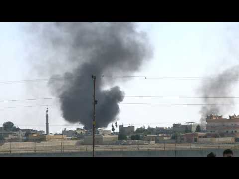 Smoke billows above Tal Abyad as Turkey strikes Syrian border towns