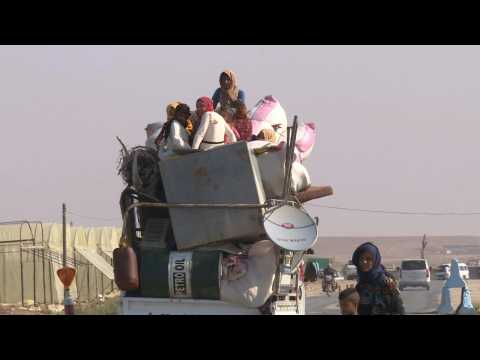 Residents of Syria border town Ras al-Ain flee Turkish offensive
