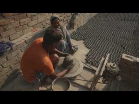 Indian artisans ramp up clay lamps production ahead of Hindu festival of Diwali