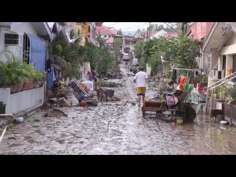 Filipinos return to mud-soaked homes after Typhoon Goni
