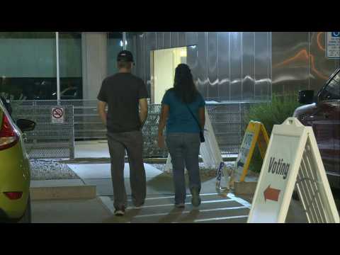 Voters arrive to cast ballots as polls open in the battleground state of Arizona