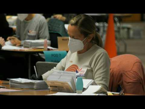 Election workers count mail-in ballots in battleground Wisconsin