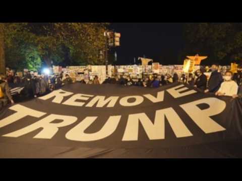 Hundreds gather in DC to protest Trump as they await election results