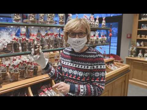 German confectionery makes chocolate Christmas figures with masks