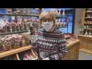 German confectionery makes chocolate Christmas figures wearing masks